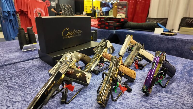 Custom Firearms Displayed at A Booth at A Gun Convention