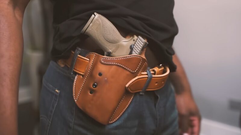 A Man with A Gun in A Leather Holster
