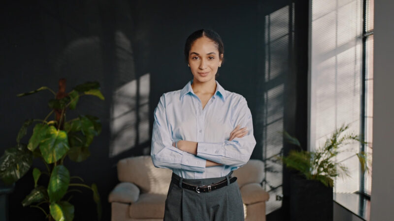 A girl with crossed arms, reflecting a person with a strong stance in her career