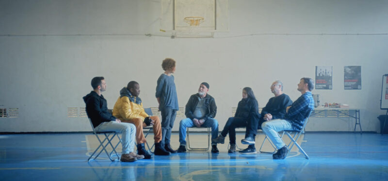 A woman is giving a speech in a support group