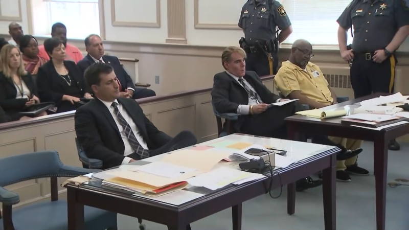 Lawyers and A Defendant in A Courtroom During a Bus Accident Case Being Heard by The Court