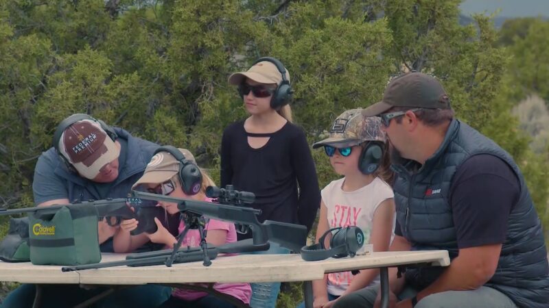 A Group of Adults Is Teaching Children how To Safely Handle a Rifle